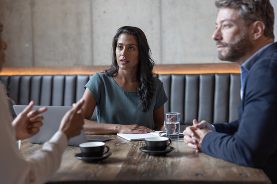 Businesspeople having a meeting in a restaurant
