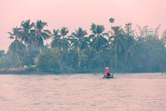 Vietnamese woman on small boat, Mekong Delta, Can Tho, Vietnam