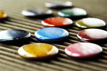 Various colored pins on corrugated cardboard, angle view