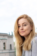 portrait of blonde woman on the street in helsinki finland