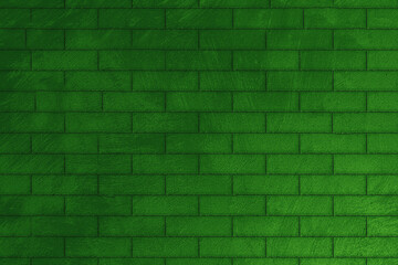 A decorative image of a green brick wall with dirt and stains in close-up