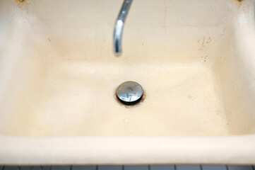 Old dirty sink in bathroom