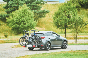 Bicycles mounted on back of car