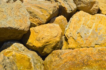 golden rocks background. golden granite