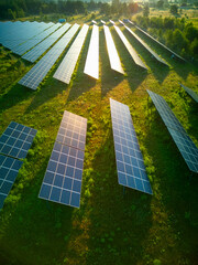 Solar panel produces green, environmentaly friendly energy from the setting sun. Aerial view from...