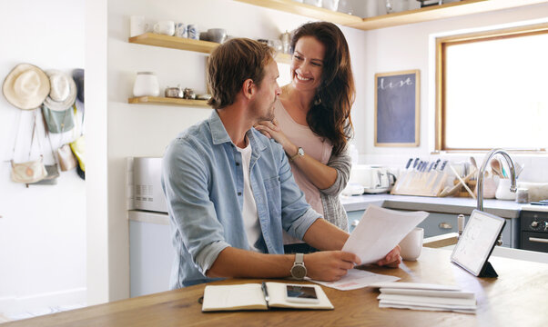 Happy, couple and documents with hug at house for financial planning, bank balance or debt payment. Man, woman or paperwork for budget savings, property insurance and credit score of loan application - Powered by Adobe