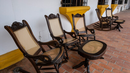 the chairs in the front of a Spanish colonial house in santa cruz de mompox, Colombia, south america