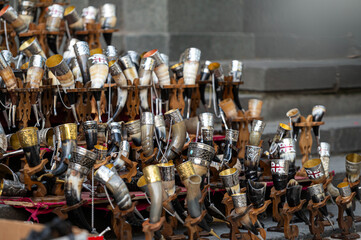 Collection of Ornate Drinking Horns on Display at a Local Artisan Market in Autumn