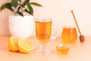 tea with lemon and honey, beige background