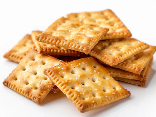 Freshly Baked Crunchy Crackers Stacked Neatly on White Background During Daytime