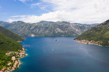 Aerial view of the Bay of Kotor, Montenegro. We are flying by the sea bay.