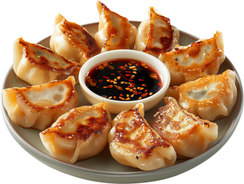 A plate of delicious dumplings with a dipping sauce, perfect for an appetizer or snack. Crispy and flavorful.
