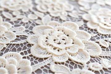 Intricate white lace floral pattern representing bridal elegance and wedding decoration themes