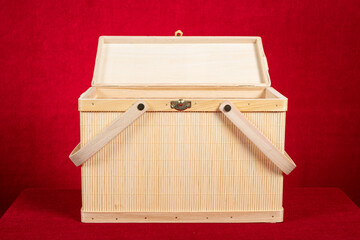 a bamboo container on red backgrond