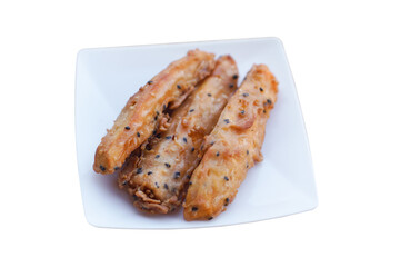 Homemade crispy deep fried sweet potato, topping with sesame, isolated on white background. Concept, deep fried food,delicious snack. Street food in Thailand.           