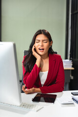 Tired asian businesswoman with headache at office, feeling sick and Chest pain, Woman feeling sick.