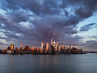 NYC, New York City Skyline with dramatic sky. American Urban Skyscrapers USA near dramatic clouds. New York City skyline, cityscape of Manhattan in New York. Panoramic view on Manhattan. USA.