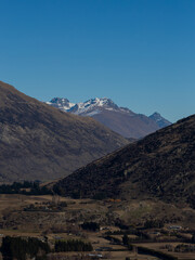 Layer of mountains with clear sky.