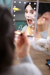 young woman with artistic spooky makeup