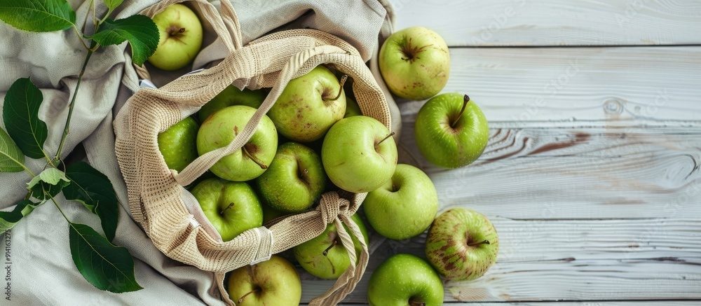 Poster eco friendly bag with green apples on white wooden backdrop showcasing sustainable living with zero 