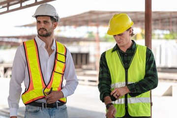 Technician engineer in hardhat working at construction site, Foreman worker on a construction site