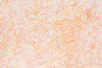 orange crayon doodles on paper background