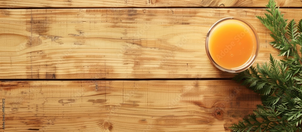 Aufkleber Wooden table with fresh carrot juice in flat lay configuration suitable for text in copy space image