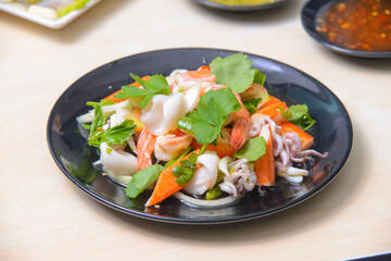 Spicy mixed seafood salad on the white background.