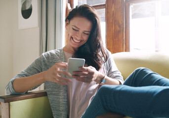 Woman, phone and happy on sofa for reading text, social media and dating site registration in home....