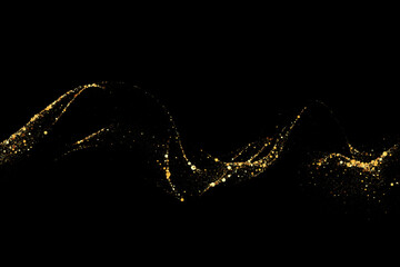 Scattered golden particles on dark background. Holiday background or design element. New Year and Christmas