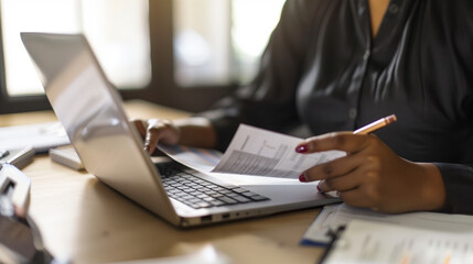 Fototapeta premium A real estate agent sitting with lease on a desk, paperwork for leases, mortgages