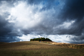 storm clouds over the field in tuscany