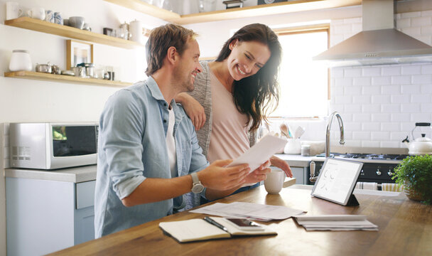 Couple, happy and tablet with documents at house for financial planning, bank balance and debt payment. Man, woman and paperwork for budget savings, property insurance and credit score of mortgage