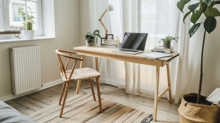 A minimalist home office with a wooden desk, chair, and laptop. Plants and a lamp provide a touch of life and warmth.