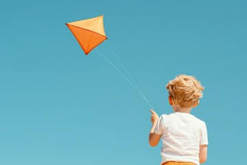 A joyful child flying an orange kite against a clear blue sky, embodying the spirit of playfulness and outdoor adventure.