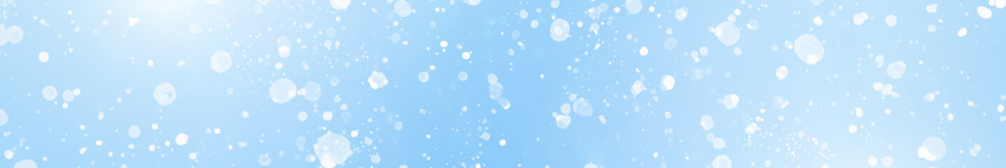  White Bokeh Light Effects on Blue winter Background. Long banner