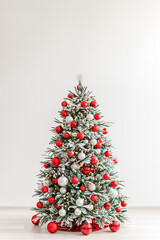 Decorated Christmas tree on light background