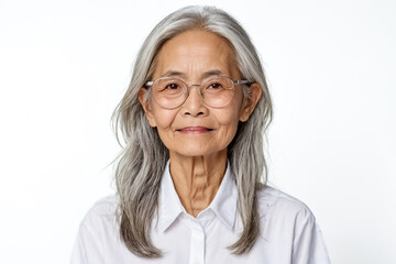 Portrait of a smiling senior woman with grey hair wearing glasses