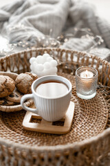 Home coziness composition with a cup of tea. Autumn home comfort.