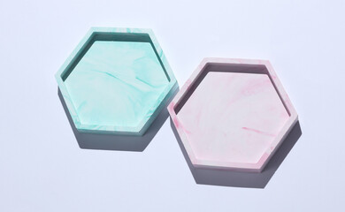 Hexagonal plaster trays on white background. Top view