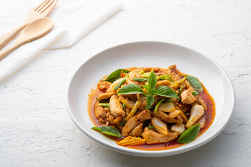 Stir fried chicken with roasted chili paste on white plate