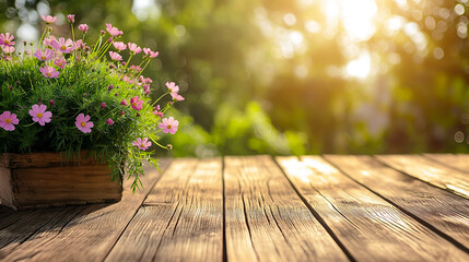 Wooden table with pink flowers in a garden at sunset. Copy space