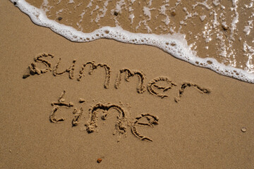 inscription on the sand of Summer Time