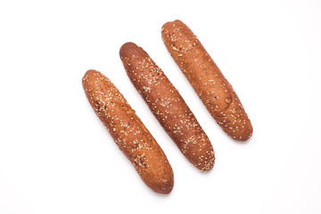 Rye buns, mini baguettes on a white background