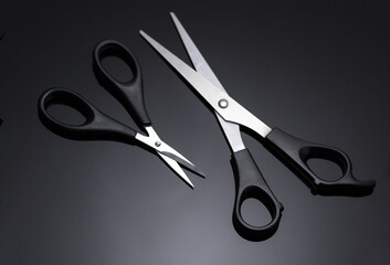 Barber scissors for haircut on black background