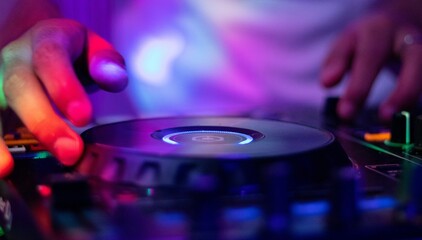 Dj Mixing Tracks at a Vibrant Party Illuminated by Dynamic Light Displays