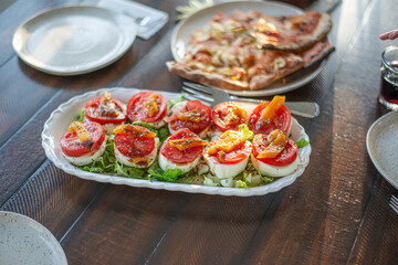 healthy dinner fresh delicious caprese salad on salad leaves