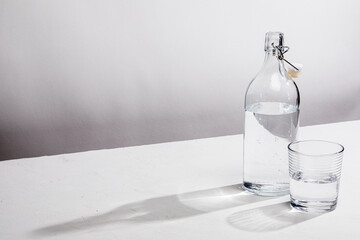 Clear glass water bottle with glass
