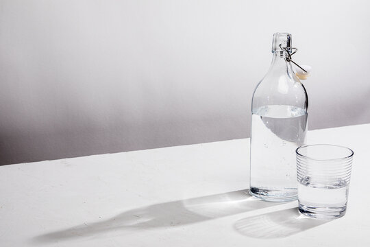 Clear glass water bottle with glass
