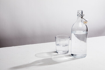 Clear glass water bottle with glass
